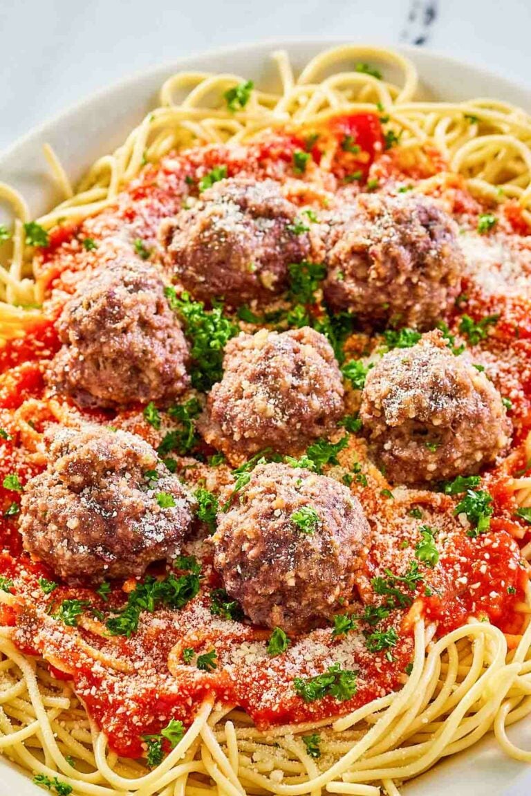 Copycat Olive Garden spaghetti and meatballs on a platter.