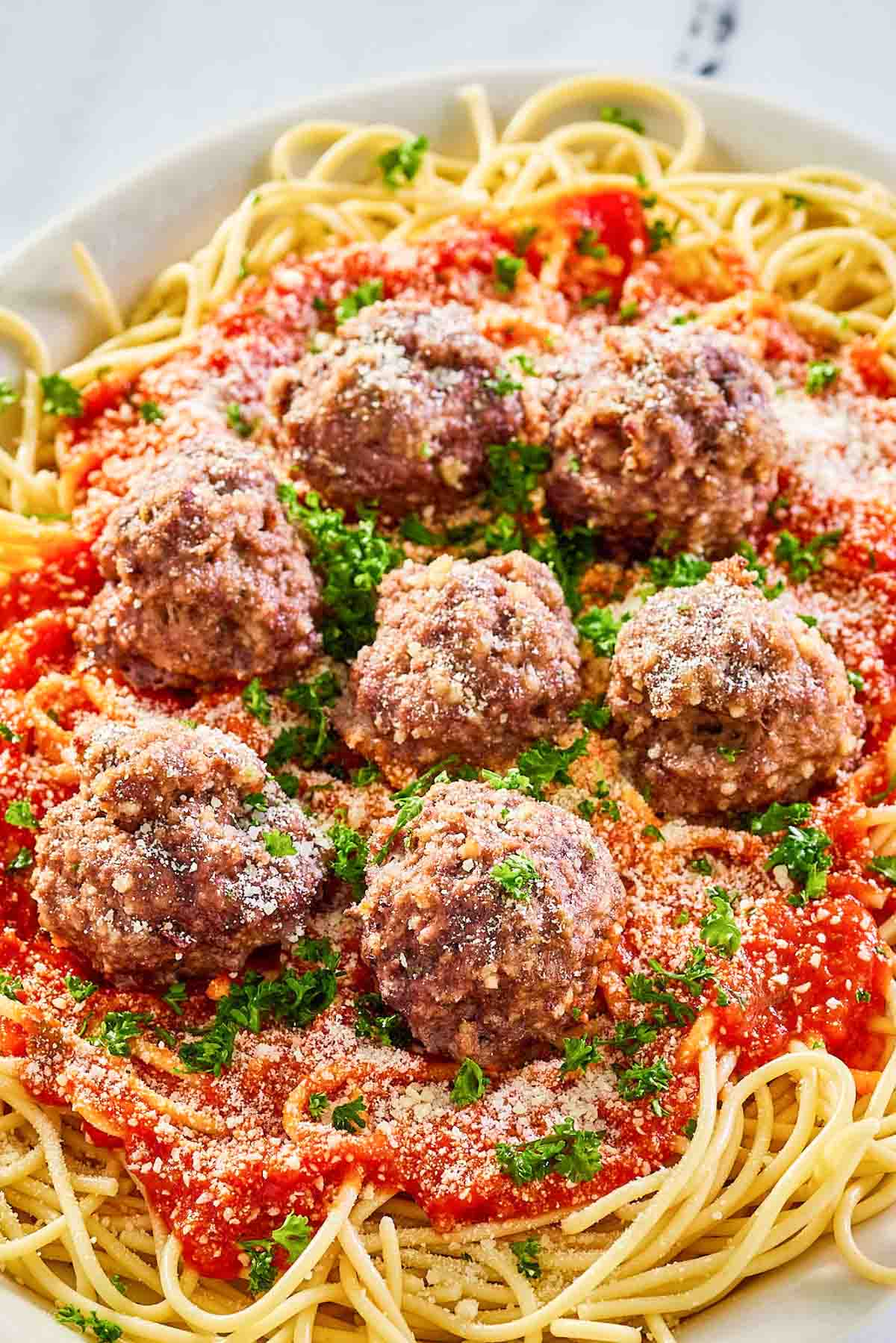 Copycat Olive Garden spaghetti and meatballs on a platter.