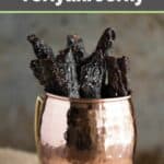 Homemade teriyaki beef jerky in a mug.