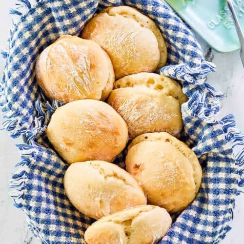 Overhead view of angel biscuits in a basket.