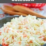 Copycat Captain D's coleslaw in a bowl and wooden spoons behind it.