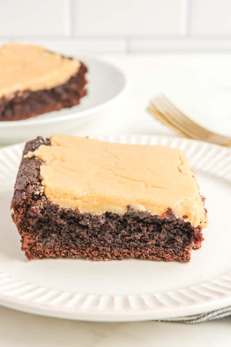 Chocolate caramel cake slices on plates.