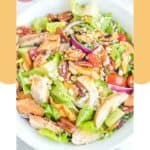 Overhead view of homemade Panera fuji apple salad in a white bowl.