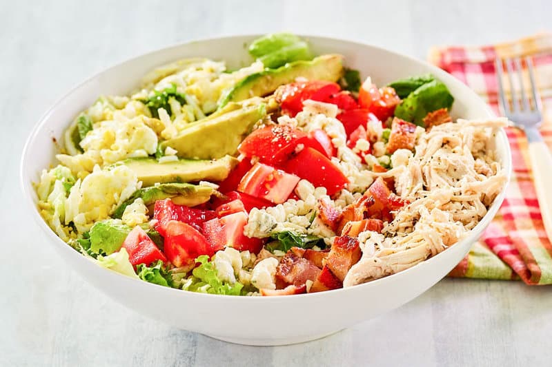 Copycat Brown Derby cobb salad in a large white salad bowl.