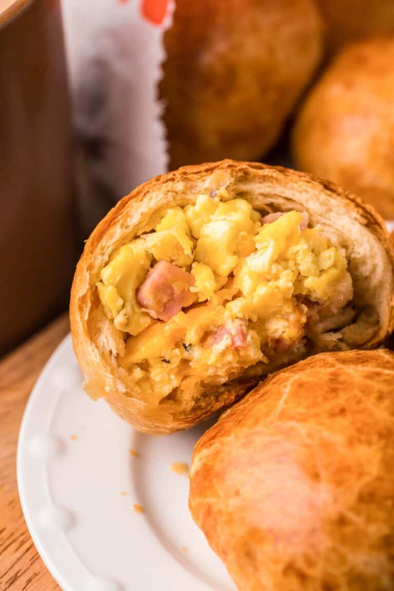 Copycat Dunkin stuffed biscuit bites with ham, egg, and cheese on a plate.