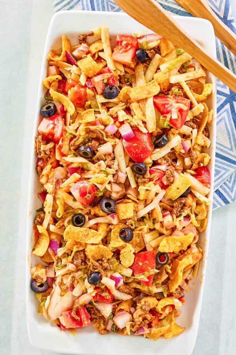 Overhead view of frito taco salad on a platter.