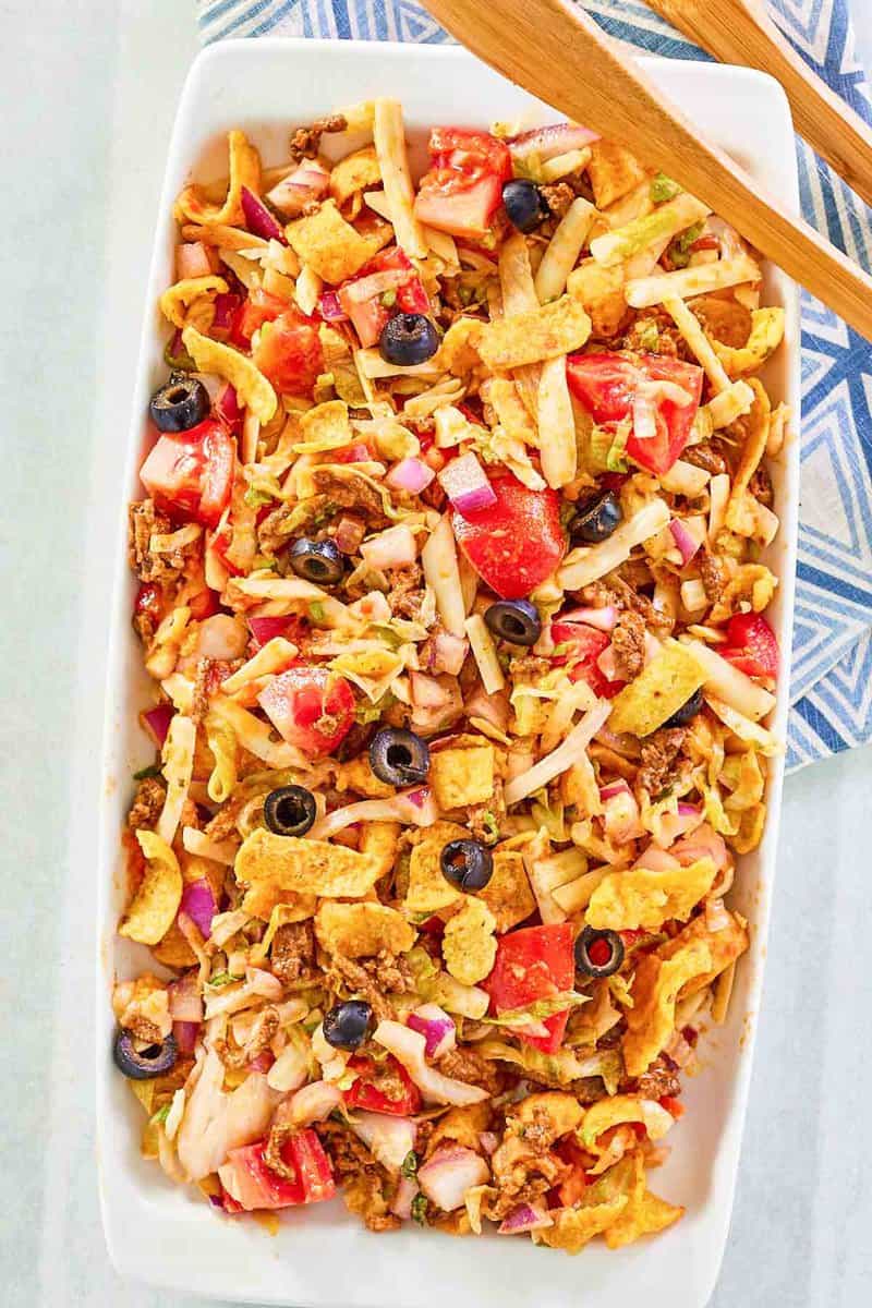 Overhead view of frito taco salad on a platter.