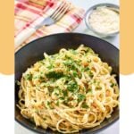 Homemade Pasta House fettuccine alfredo in a black bowl.