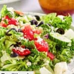 Closeup of a traditional Greek salad on a large salad plate.