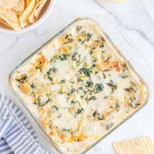 Overhead view of copycat Applebee's spinach artichoke dip and tortilla chips.