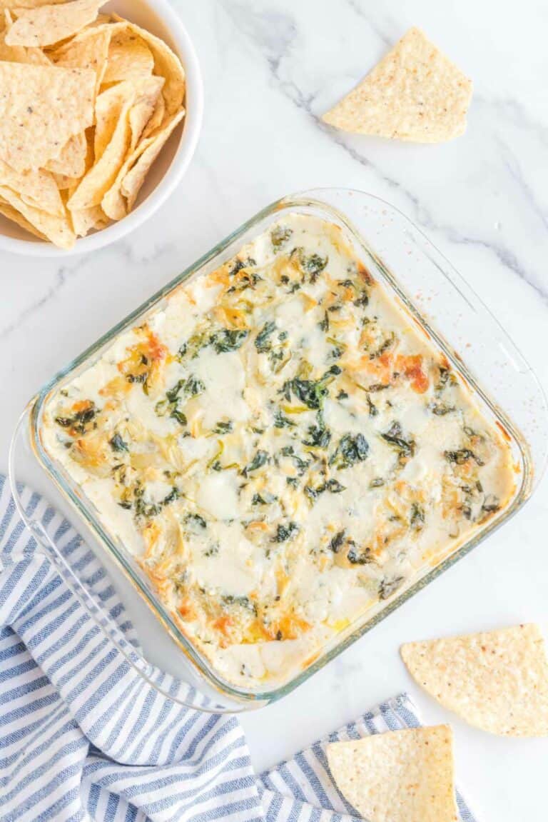 Overhead view of copycat Applebee's spinach artichoke dip and tortilla chips.