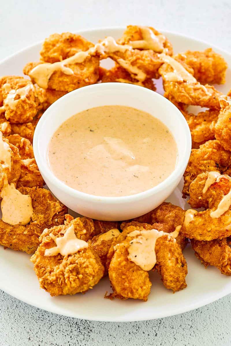Copycat Outback bloomin fried shrimp and a bowl of bloomin sauce.