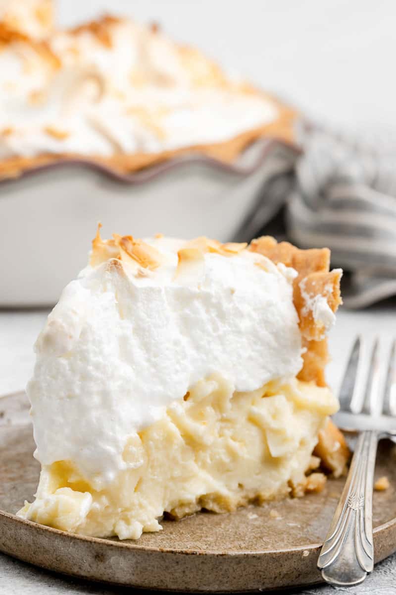 Copycat Luby's coconut meringue pie slice on a plate.