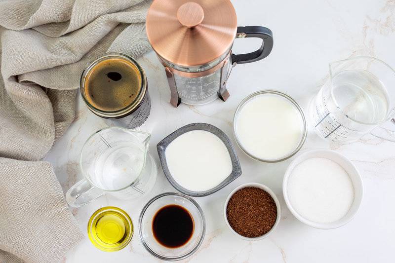 Copycat Starbucks oleato golden foam cold brew coffee ingredients on a marble surface.