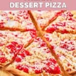 Homemade CiCi's cherry dessert pizza on a wood board.