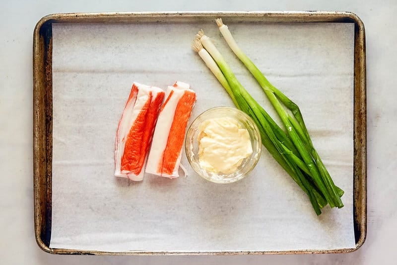 Imitation crab salad ingredients on a tray.