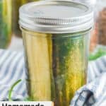 A jar of homemade spicy pickles on top of a kitchen towel.