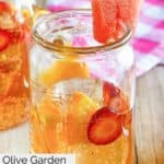 Homemade Olive Garden watermelon sangria and fruit in a glass.