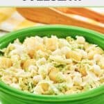 Pineapple coleslaw with marshmallows in a green bowl.