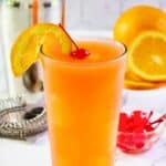 Homemade Applebee's Bahama Mama garnished with an orange slice and cherry.