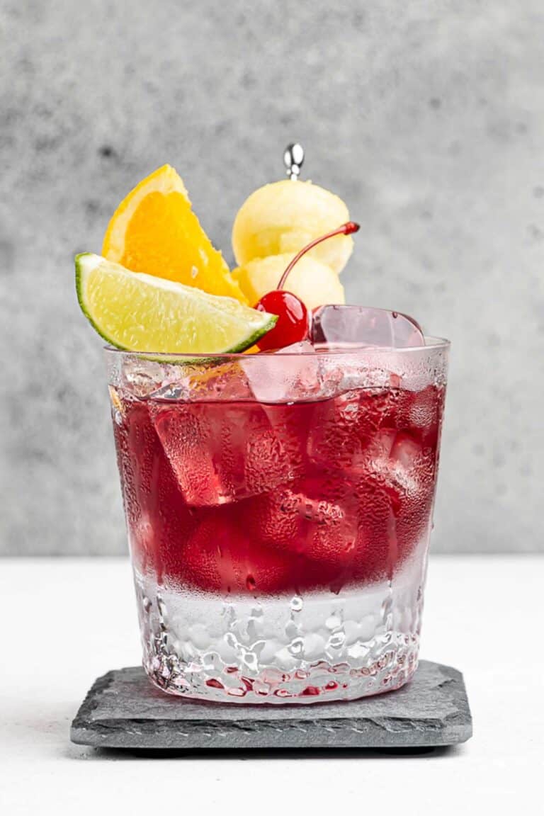 Copycat Applebee's red apple sangria on a coaster.