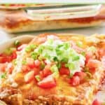 Closeup of a serving on burrito casserole on a plate.