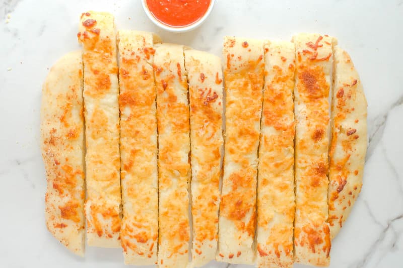 Copycat Pizza Hut cheese sticks and a bowl of marinara.
