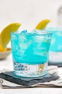 Copycat Olive Garden Blue Amalfi drink on a coaster.