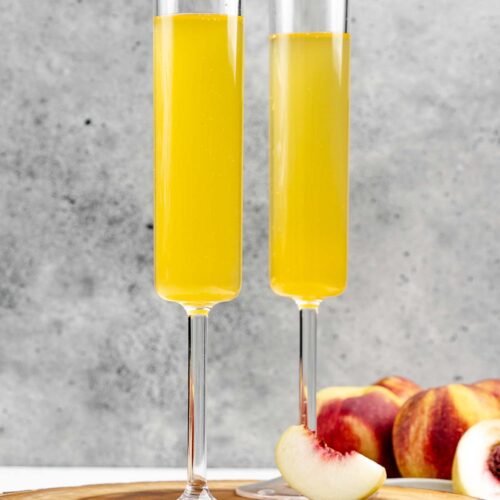Two copycat Olive Garden peach bellini drinks.