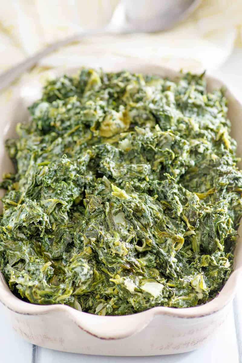 Copycat Boston Market creamed spinach in a baking dish.