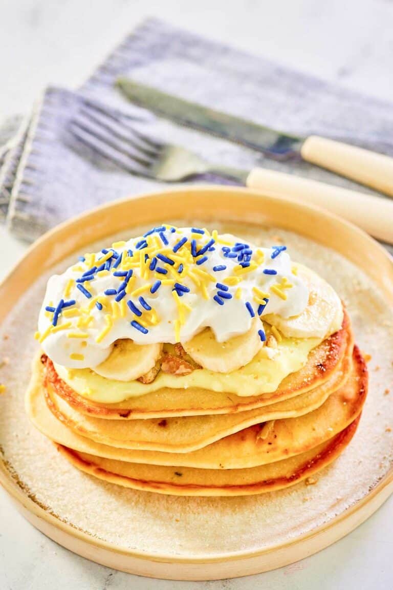 Copycat IHOP minion pancakes and a knife and fork on a napkin.