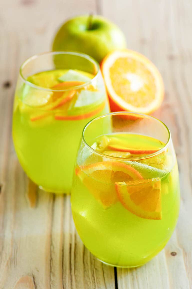Copycat Olive Garden green apple moscato sangria in two glasses.