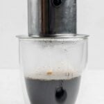 Brewing Vietnamese coffee with a phin filter.