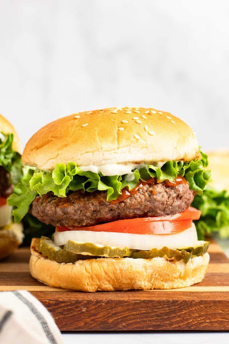 Copycat Burger King Whopper on a wood board.