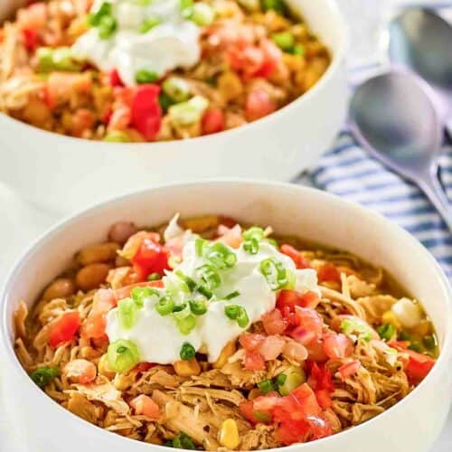 Crockpot white chicken chili in two bowls.