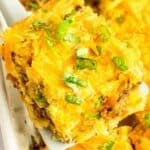 A slice of Mexican cornbread casserole on a spatula.
