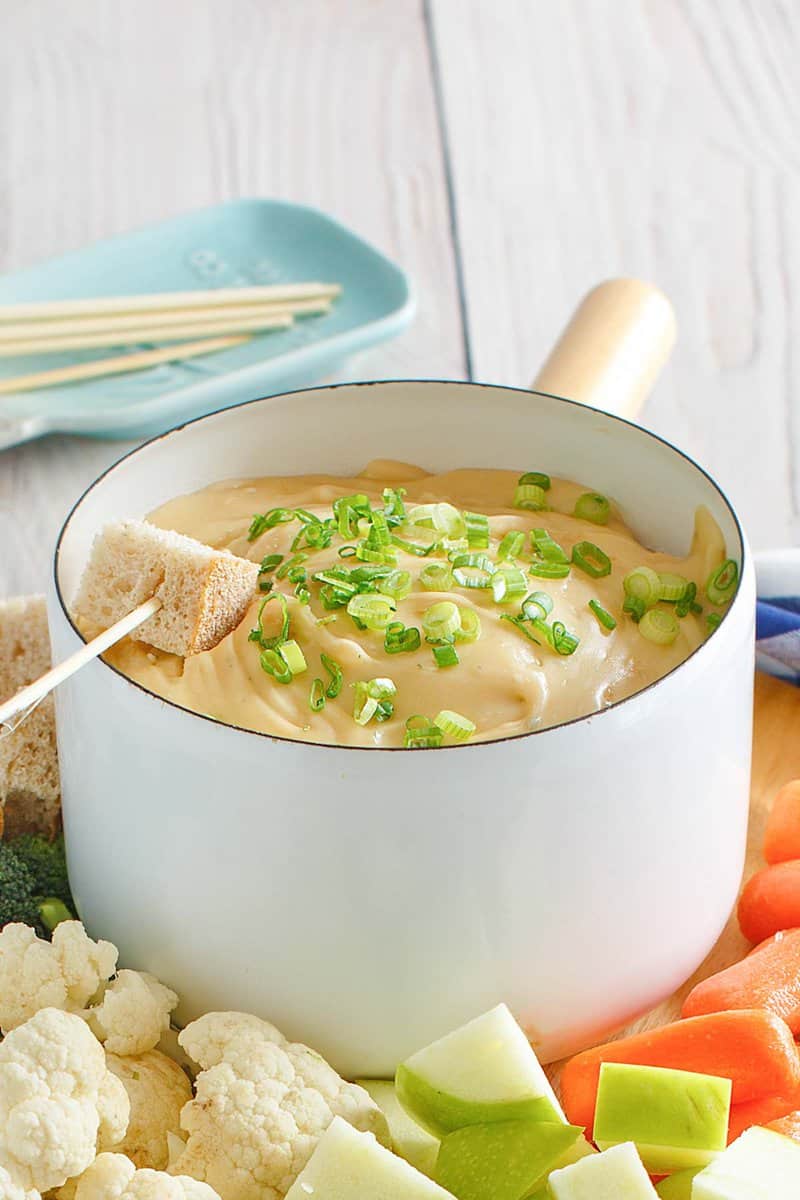 Copycat Melting Pot Wisconsin trio cheese fondue in a fondue pot.