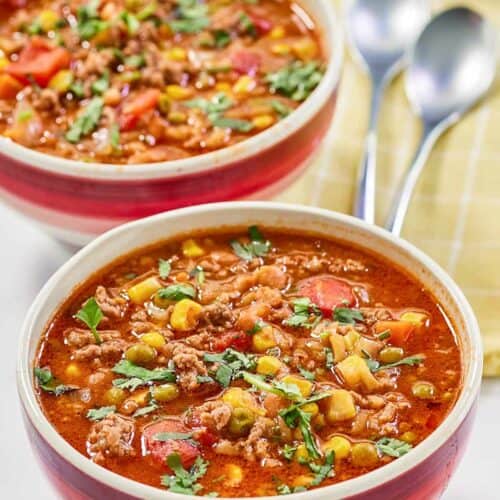 Cowboy soup garnished with fresh parsley.