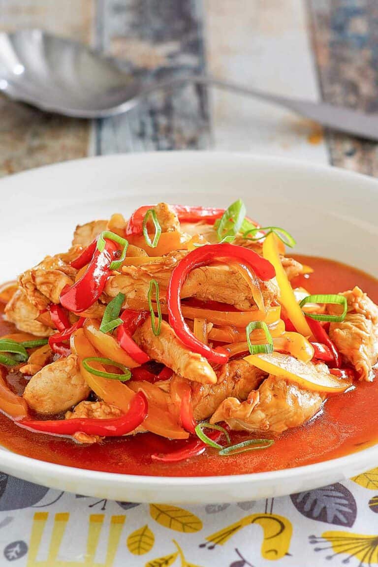Copycat Panda Express firecracker chicken in a bowl and a spoon behind it.