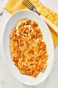 Copycat Waffle House hash browns on a plate and a fork next to it.