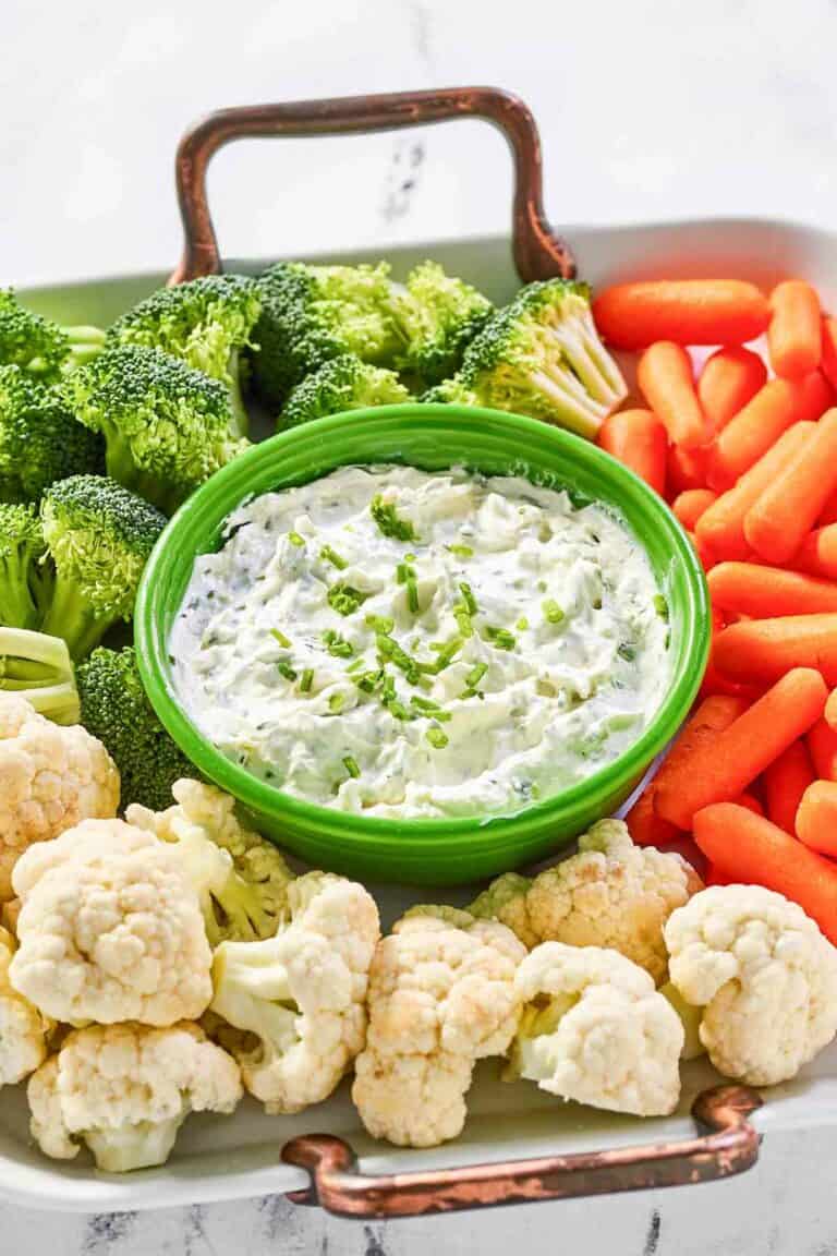 Copycat Melting Pot green goddess dip and fresh vegetables on a tray.