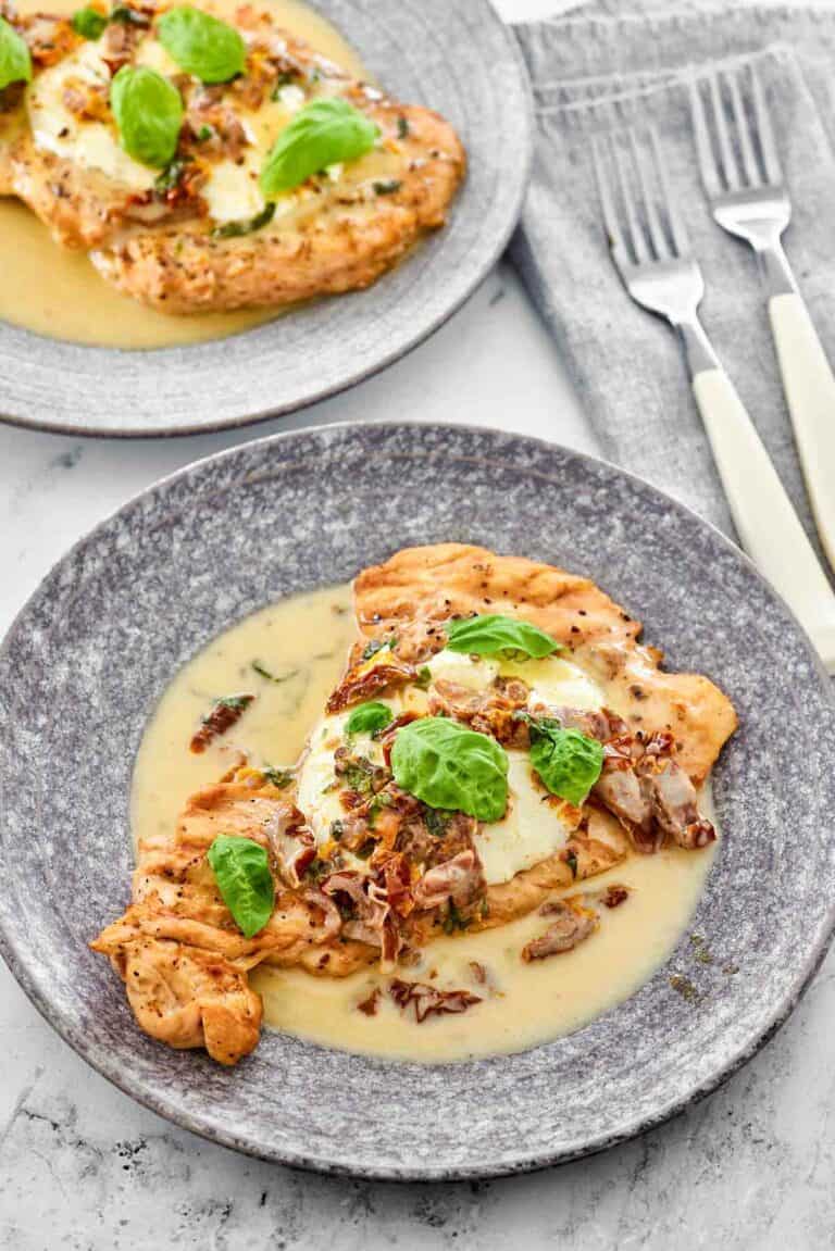 Copycat Carrabba's chicken bryan on two plates.