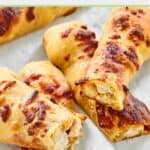 Two homemade Costco chicken bakes cut in half.