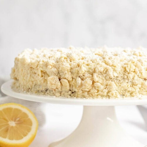 Copycat Olive Garden lemon cream cake on a cake stand.