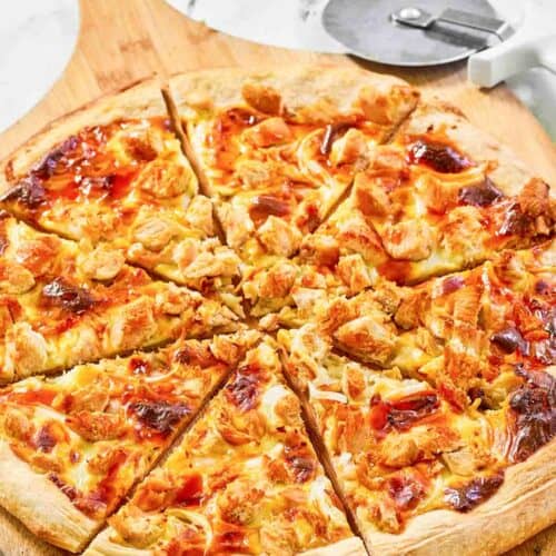 Copycat Domino's Buffalo chicken pizza on a pizza peel.