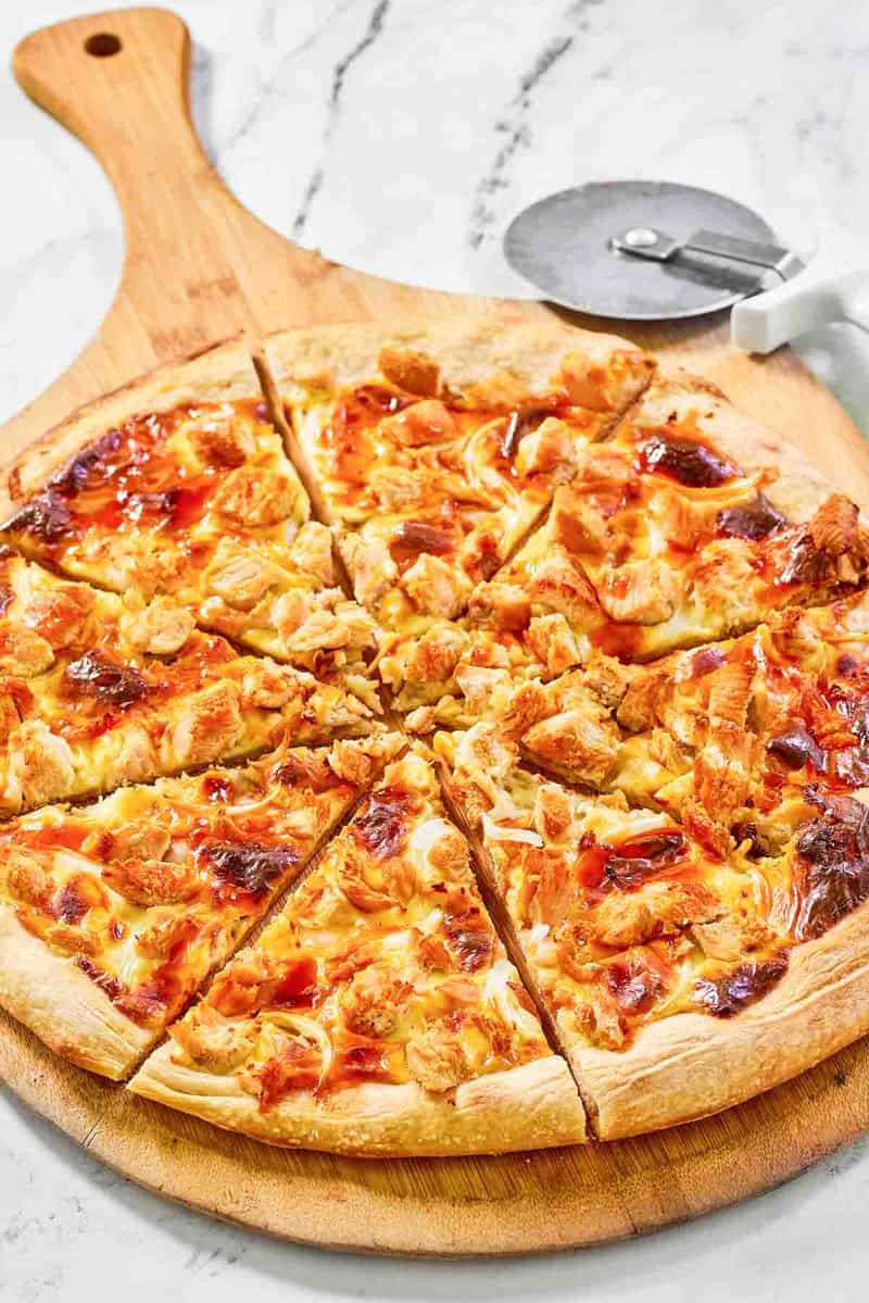 Copycat Domino's Buffalo chicken pizza on a pizza peel.