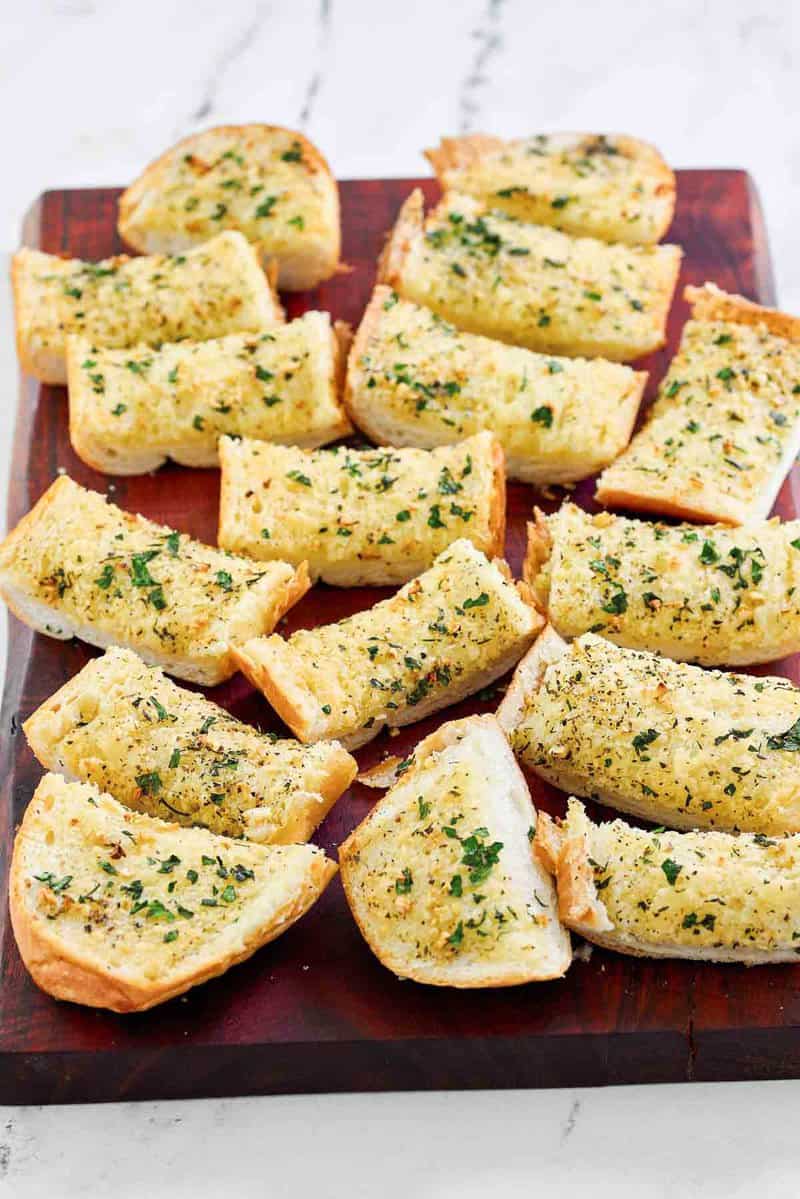 Copycat Brennan's garlic bread on a wood cutting board.