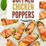 Bacon wrapped buffalo chicken poppers scattered on parchment paper.