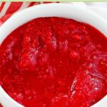 Homemade cranberry jello salad in a bowl.