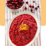 A bowl of homemade Luby's cranberry relish and a bowl of fresh cranberries.